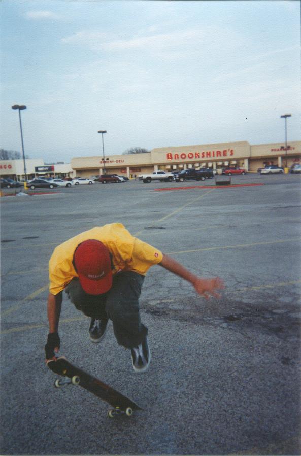 Catching the board after an ollie fingerflip.