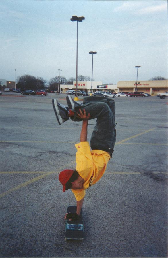Getting ready to flip out of a single hand handstand.